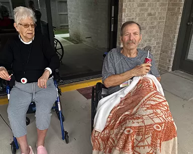 Residents enjoying outdoor time at Providence Assisted Living Solutions in Fulshear
