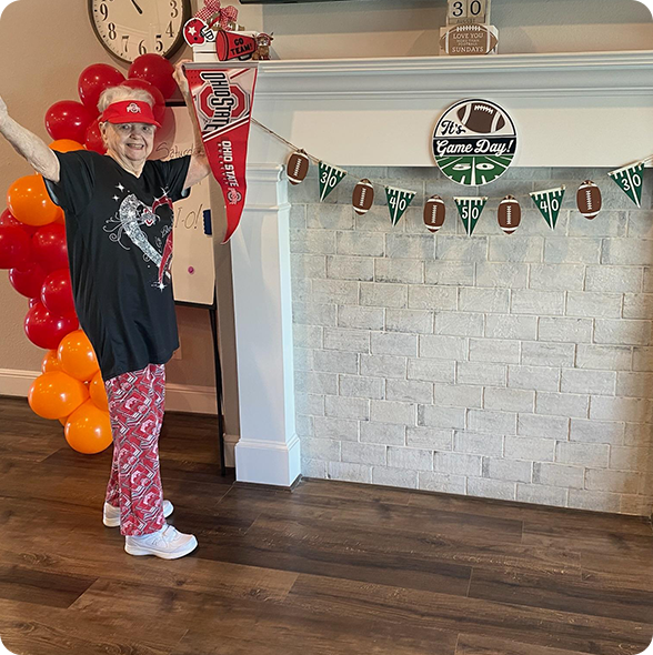Resident celebrating football season at Providence Assisted Living Solutions in Fulshear