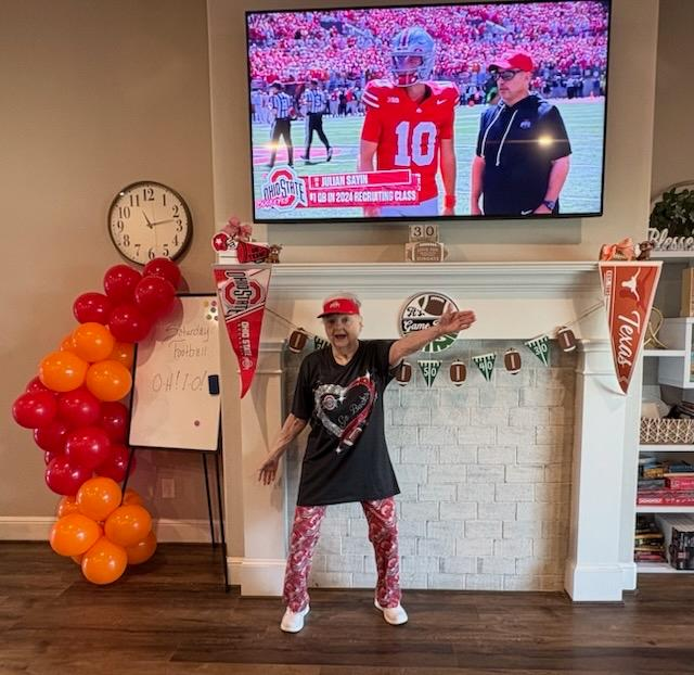 Resident celebrating football season at Providence Assisted Living Solutions in Fulshear